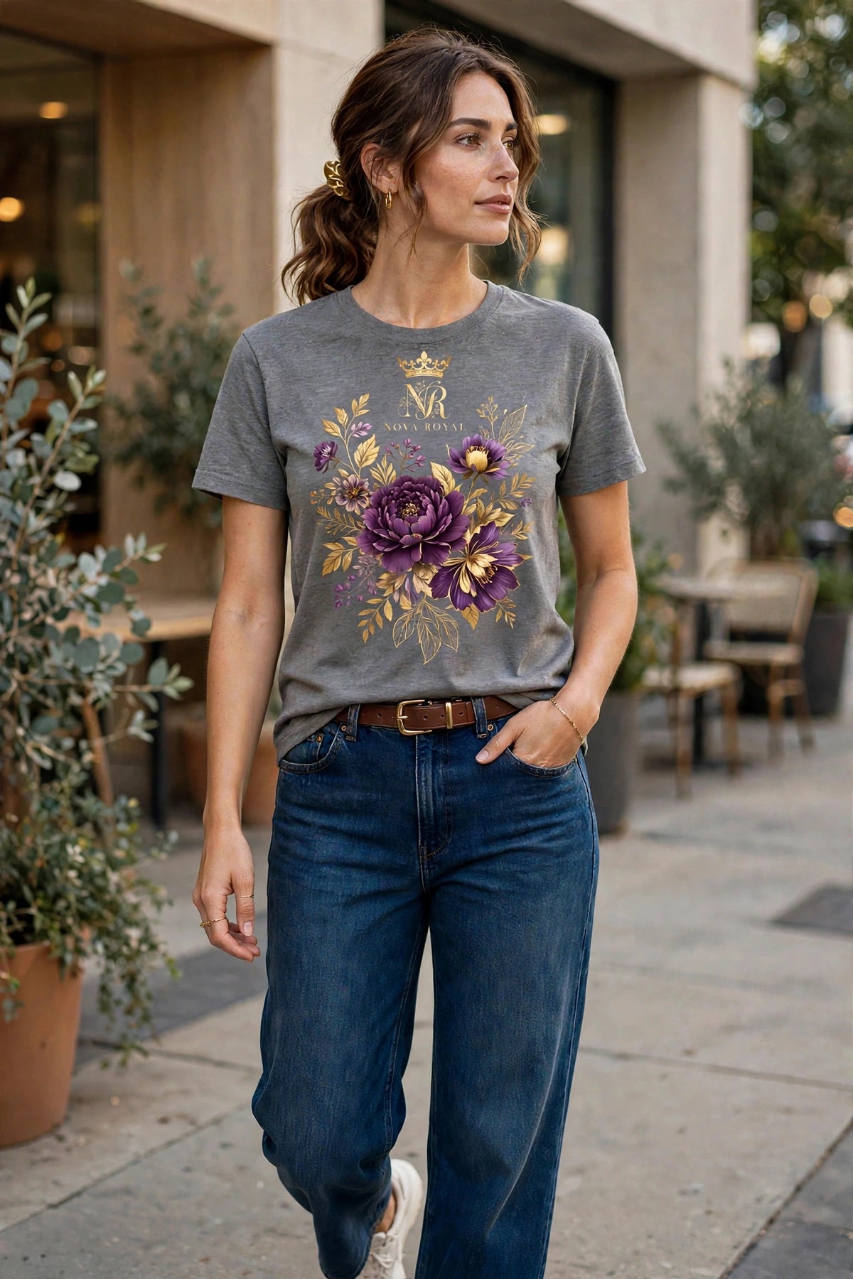 Woman wearing Grey Nova Royal Royale Floral T-Shirt with gold NR logo on top