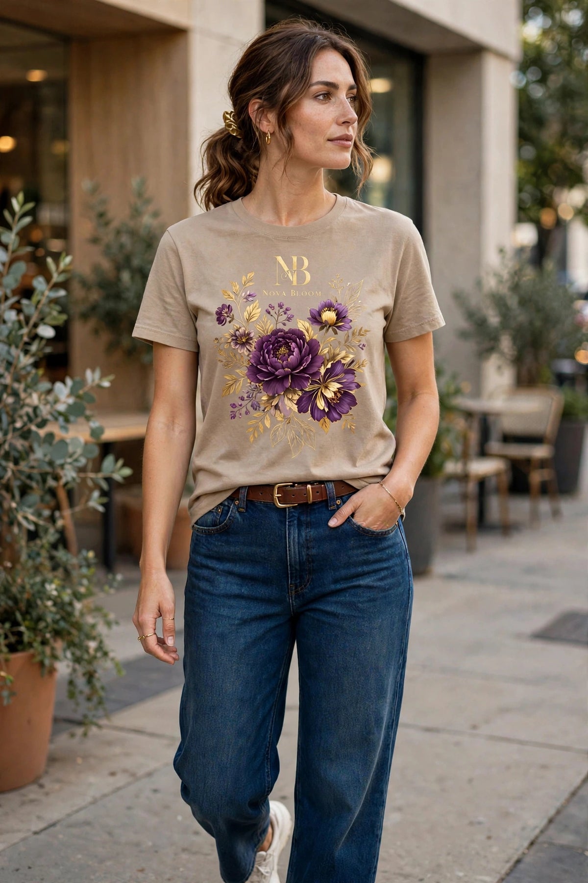Woman wearing Beige Nova Royal Royale Floral T-Shirt with gold NR logo on top