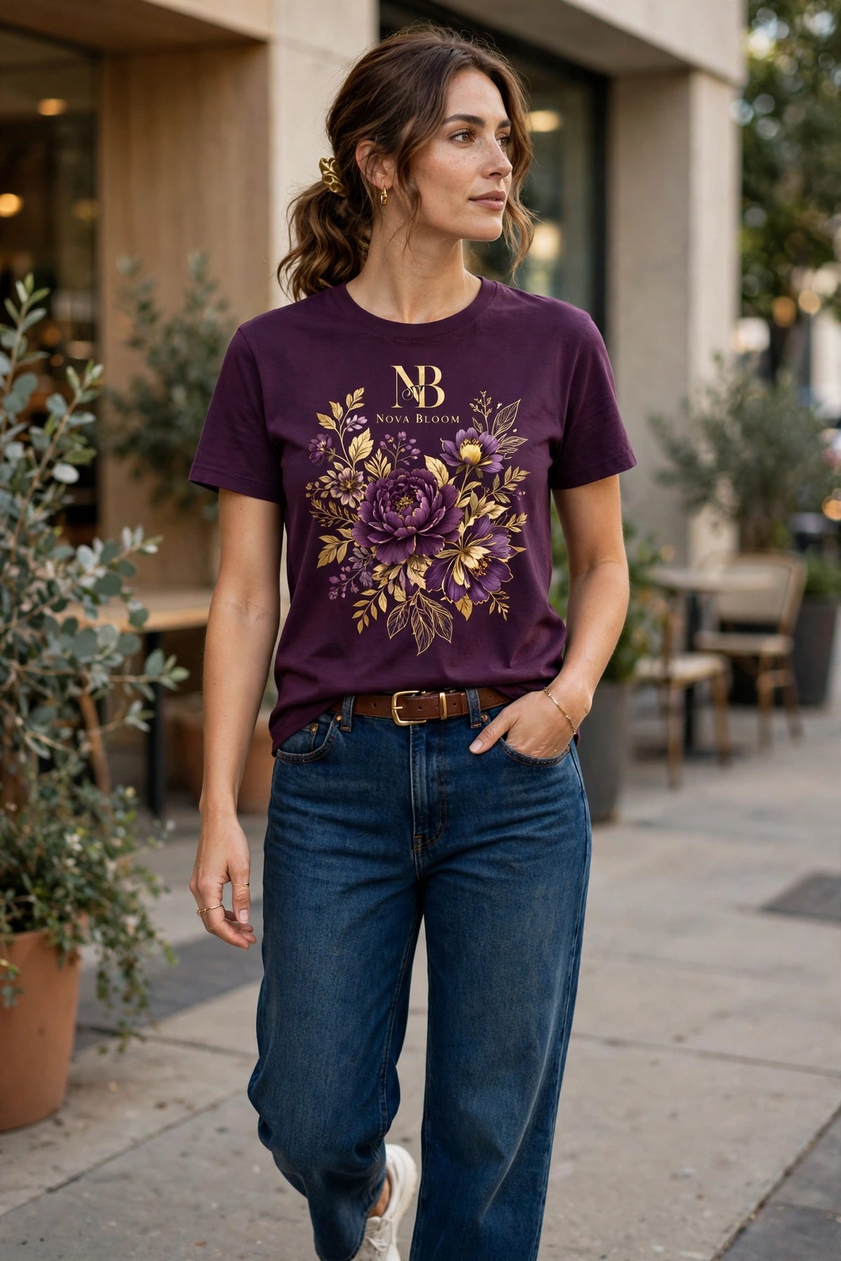 Woman wearing Purple Nova Royal Royale Floral T-Shirt with gold NR logo on top — chosen picture